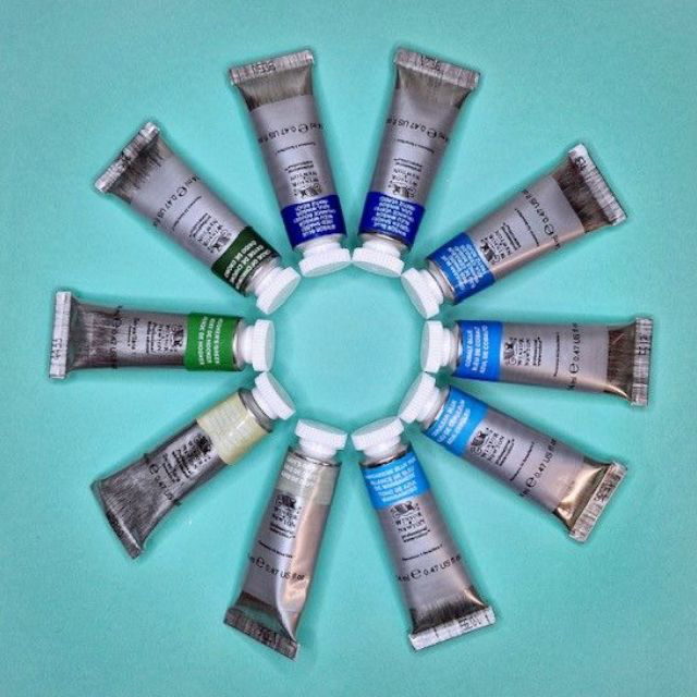 A colourful circular arrangement of different oil 
