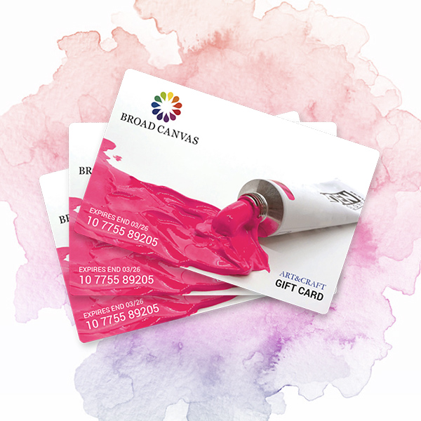 A set of pink and white gift cards layered over ea