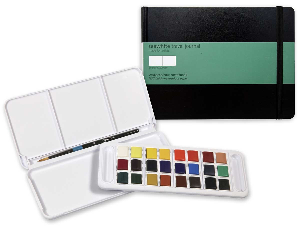 A compact travel sketchbook alongside a travel wat
